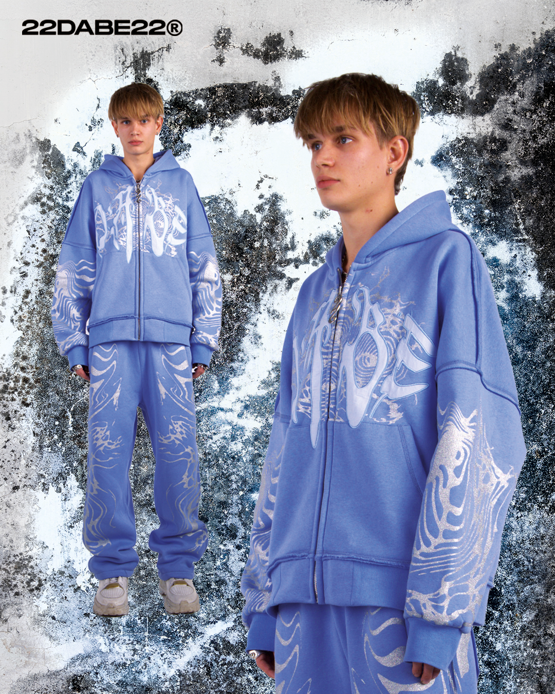 A pair of light blue joggers with glitter screen print on both sides, an embroidery appliqué at the back pockets, and a distressed finish. Made of 80% Cotton and 20% Polyester blend with a peached interior for ultimate comfort and durability. Oversized fit and perfect for streetwear collection.